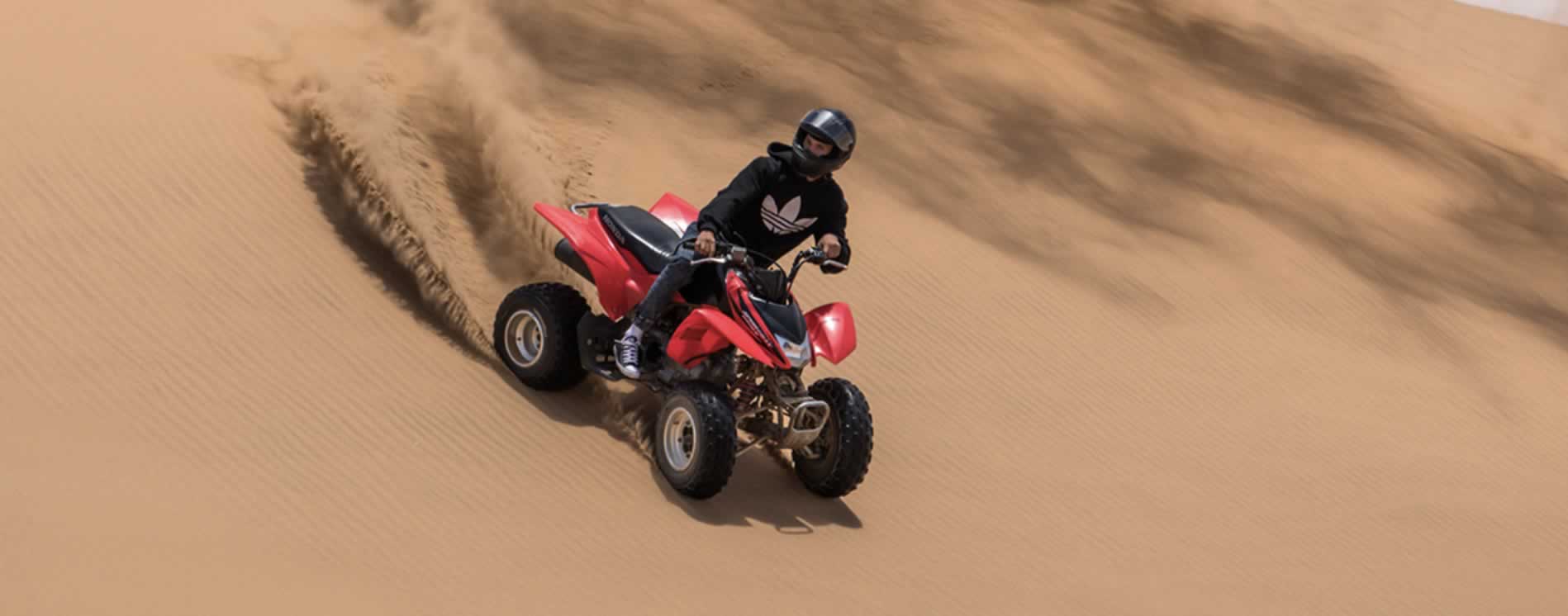 crossing the dunes in quad